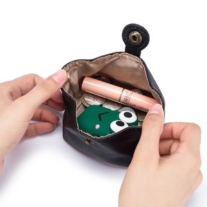 Mini black soft leather coin purse showing interior storage for lipstick and small items