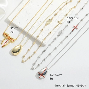 14K gold plated necklace set with cross, bow, and teardrop pendants in vintage style