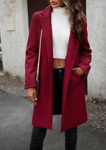 Outdoor street style view of elegant red wool coat with lapel collar and casual fit