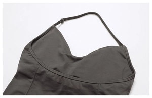 Detailed macro view of taupe yoga vest seams and elastic knitted fabric texture