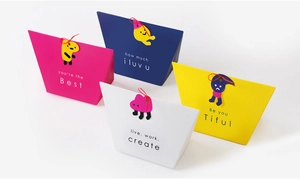 Detail of colorful trapezoid gift boxes with emotional phrases and cartoon gift tags