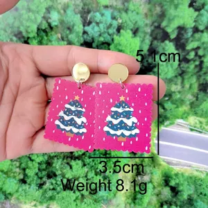 Detailed view of pink acrylic Christmas tree earrings showing 5.1cm length dimension