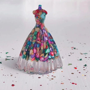 Detailed macro view of crystal stone resin princess dress figurine with glitter
