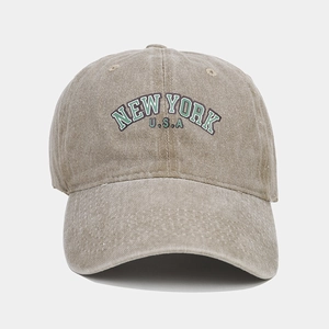 Detailed texture of a vintage washed cotton baseball cap with New York U.S.A lettering