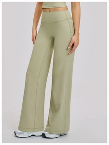 Close-up of sage green wide-leg yoga pants with high waist and front seam detail