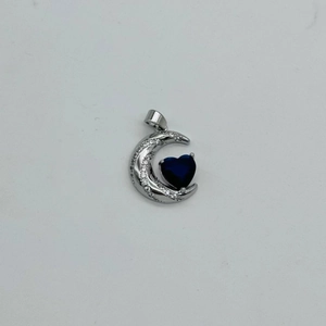 Silver crescent moon and blue heart zircon pendant with sparkling white gemstones