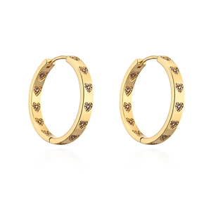 Detail of 18K gold hoop earrings with small pink and purple heart-shaped zircons
