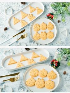Detail of white plastic Christmas cookie cutters with Santa and reindeer shapes