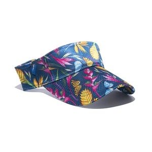 Detailed macro view of a floral print faux silk sun visor hat with a curved brim design