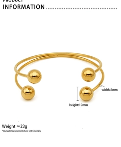 Technical drawing showing 10mm gold beads and 2mm band dimensions on an open bangle