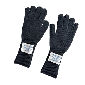 Women's black knitted wool gloves with a white vintage label and touchscreen fingerless design