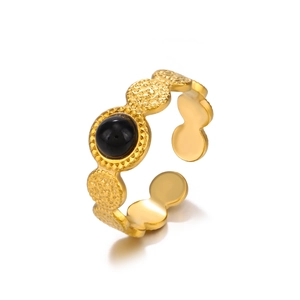 Vintage adjustable gold ring featuring a black obsidian bead and wavy textured band