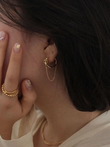 Elegant 925 sterling silver gold knotted chain earrings with a matching tiered ring