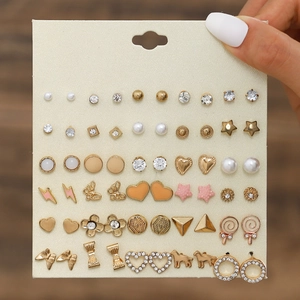 Set of 30 pairs assorted stud earrings with bow, star, and flower designs on card