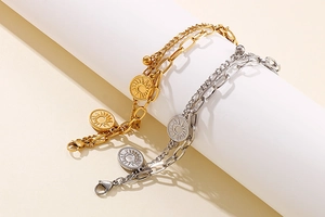 Close-up of double layer stainless steel chain with sun and moon celestial pendants