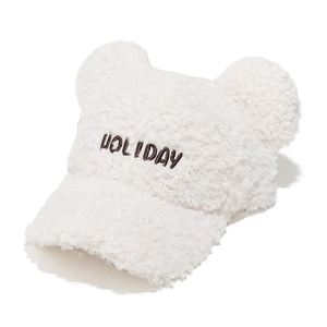 Detail of white sherpa baseball cap with bear ears and brown HOLIDAY embroidery