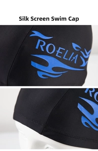 Close-up detail of the screen printing process and stitching on the black swimming cap
