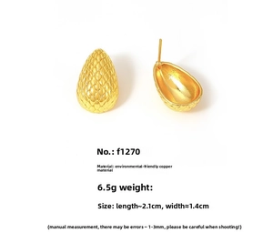 Detail of gold teardrop earrings with embossed texture and product specifications