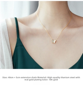 Close-up of 18K gold-plated butterfly necklace with white shell inlay on titanium steel