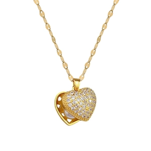 Luxurious gold heart pendant necklace with shimmering zircon pave and inner white pearl
