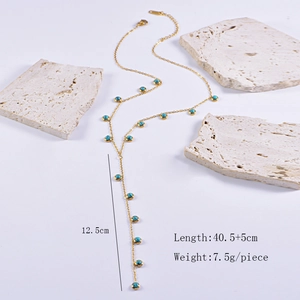 Detailed Y-shaped gold necklace with turquoise beads and 12.5cm tassel drop pendant