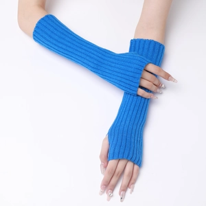 Detail of bright blue ribbed knit texture on long fingerless gloves for autumn and winter