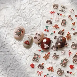 Detail of 3D embossed nail stickers featuring cute bears and dogs for autumn winter style