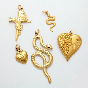 Polished gold ocean series pendants featuring cross, snake, heart and angel wings styles