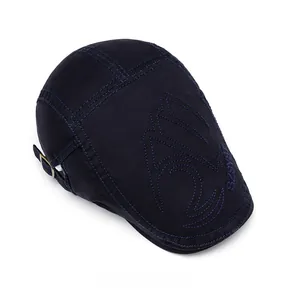Detail of navy canvas flat cap featuring fine stitching and vintage metal side buckle