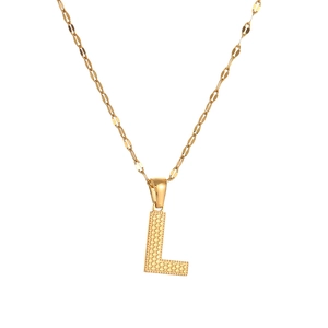 Detailed close-up of golden letter L pendant with unique dotted texture on a fine chain