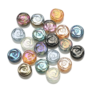 Detailed view of 10mm glass rose flower beads with colorful electroplated iridescent finish