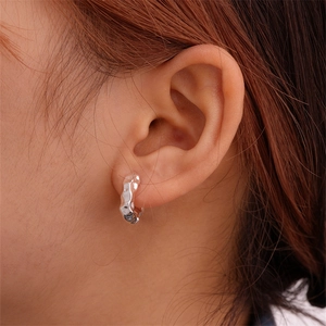 Minimalist silver irregular wrinkled metal ear cuff with a liquid metal texture for women