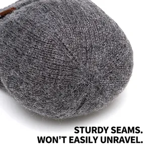 Thick grey knitted beanie with reinforced top stitching for outdoor windproof warmth