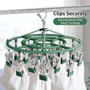 Durable green stainless steel drying rack with 20 clips for hanging socks and laundry
