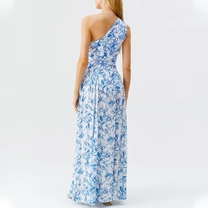 Detail of single shoulder maxi dress with blue tropical floral print on white fabric
