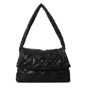 Chic black quilted shoulder bag with a puffy padded texture and minimalist crossbody style