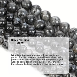 Macro shot of natural labradorite round beads showing grey spotted texture for DIY jewelry