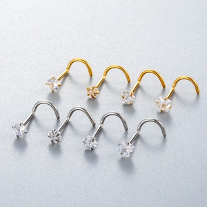 Close-up of 8pcs stainless steel nose studs with round, heart and star zircons in gold and silver