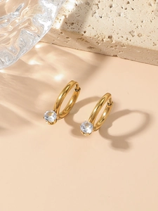 Detailed shot of 18k gold-plated stainless steel hoop earrings with clear cubic zirconia stones