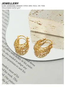 Detailed view of hollow geometric basket earrings with gold plated mesh pattern
