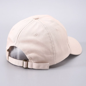 Adjustable beige embroidered heart baseball cap with bronze metal buckle back view
