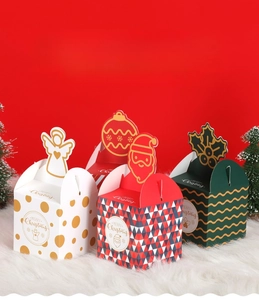 Detailed view of 3D Christmas gift boxes with festive patterns on a plush white surface