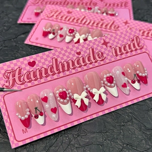 Handmade pink press-on nails with 3D cherry, red hearts, pearls and white bows