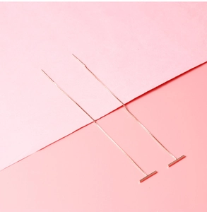 Close-up of S925 silver rose gold tassel earrings with sleek box chain and bar detail