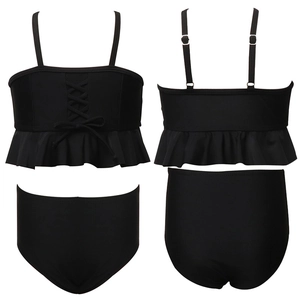 Girls' black two-piece swimsuit featuring ruffled hem, lace-up detail and high-waist bikini bottom