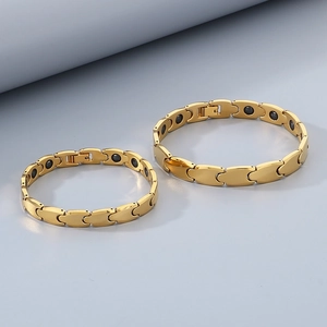Detailed view of golden magnetic tungsten steel bracelet with inset black germanium stones