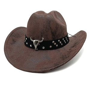 Brown western cowboy hat with vintage bull skull ornament and leather rivet band