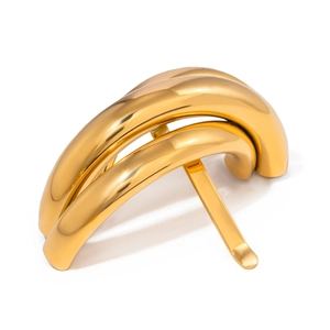 Dettaglio del pettine per capelli in acciaio inossidabile oro con barre curve minimaliste