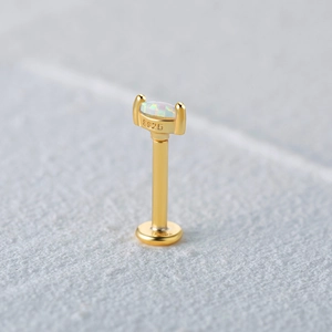 Macro shot of S925 sterling silver gold-plated labret with rectangular opal stone inlay