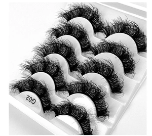 Macro shot of G02 style thick wispy false eyelashes in a professional 5-pair pack set